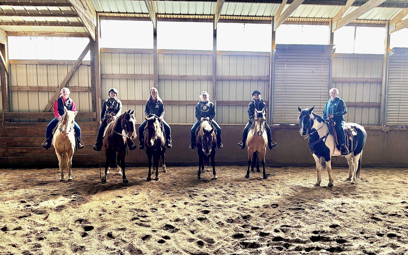 Riding lesson group in the indoor arena